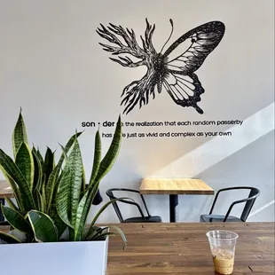 My iced doppio with half and half on table with Sonder definition in the background