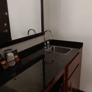 Bar and mini fridge inside room