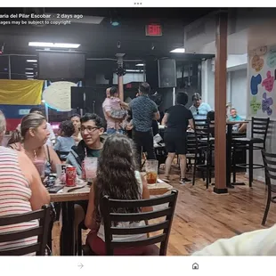 a group of people sitting around a table