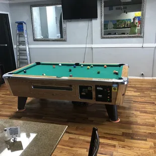 a pool table in the middle of a room