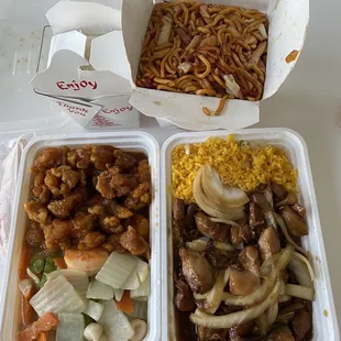 two take out containers filled with food