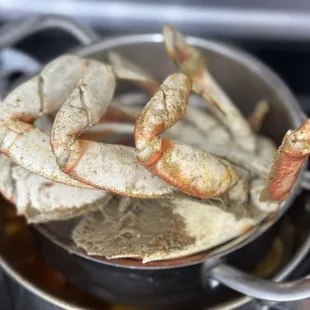 crab legs in a pot