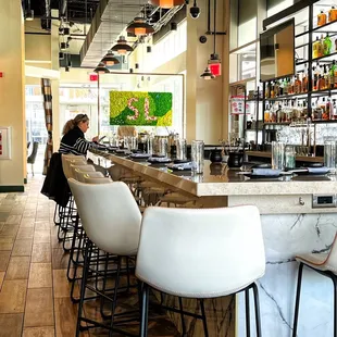 a woman sitting at the bar