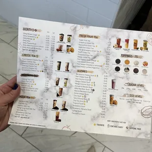 a person holding a menu