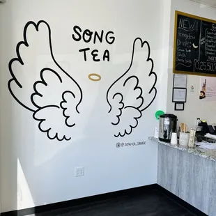two wings drawn on the wall