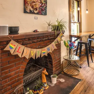 a fireplace with a bunting banner