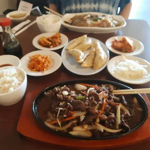 Bulgogi (marinated beef and veggies - front); Yakimandu (fried dumplings - center); Japchae (glass noodles with marinated beef - back).