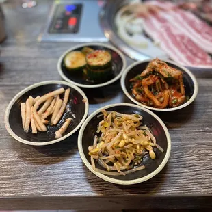 four plates of food on a table