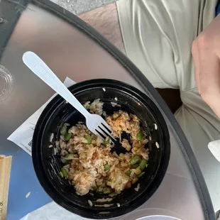 a bowl of rice and a fork