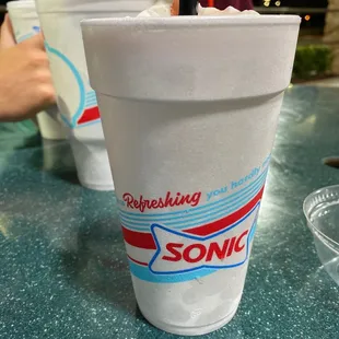 a drink in a plastic cup