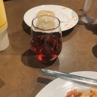 Local red wine and dinner roll