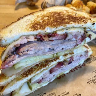 Sonny's Cuban- slow-smoked Pork, pulled &amp; sliced w/ Swiss cheese, pickles and Mustard BBQ Sauce on toasted garlic bread