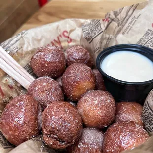 Donut holes with a glazed dipping sauce made with unsweet tea
