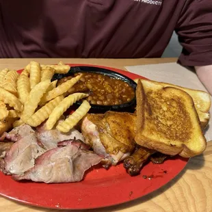 Chicken and pork- a good serving of both! Side of beans and ff:)