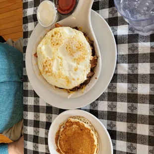 a plate of pancakes and a bowl of pancakes