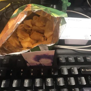 a bag of chips on a keyboard