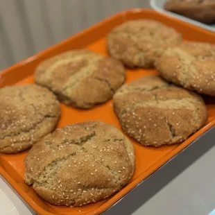 a tray of cookies and muffins