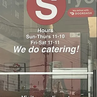 Front door with hours of operation