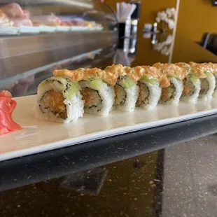 a sushi roll on a white plate