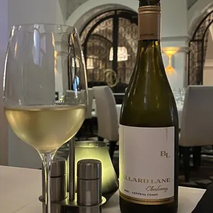 a glass of wine and a bottle of wine