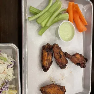 chicken wings, carrots, celery, and coleslaw
