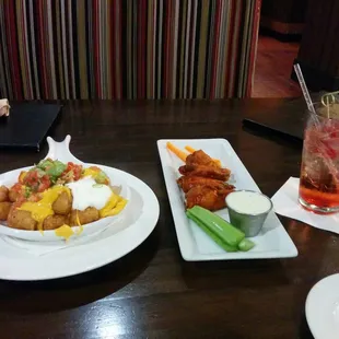 Happy hour! Tater tot nachos and buffalo wings