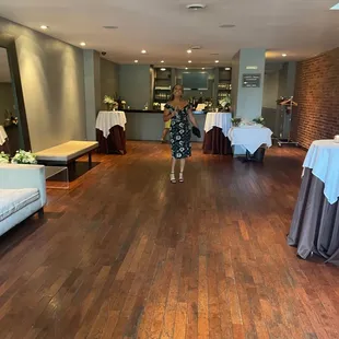 a woman standing in the middle of the room