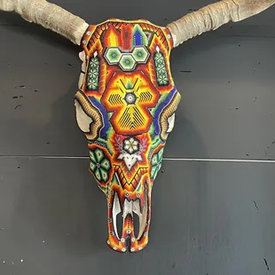 Awesome decoration. Beads on a cow skull.