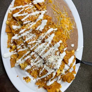 Chilaquiles plate with refried beans