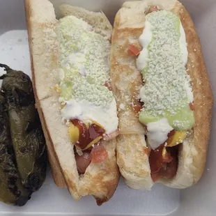 Sonora dog with frank bacon, grilled onions, guac, beans, ketchup, mustard, and mayo