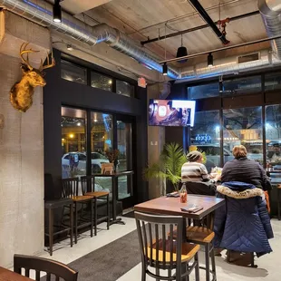 A view of the front door and TV over the front door.