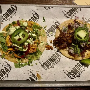 Chicken tinga taco and beef brisket taco