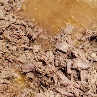 Excess juice in the meat. Pulled out over a gallon of liquid from meat that looked like tuna and smells bad.