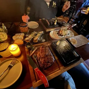 a man sitting at a table with food