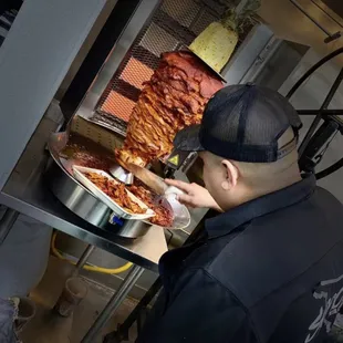 a man making a pizza