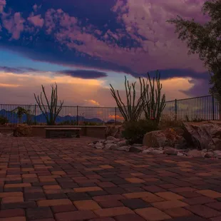 a sunset over a patio