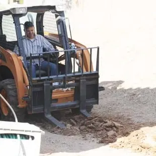 Unlike some landscape companies, Brandon is on site working with his team.