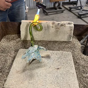 Breaking it off the pole and heating the end smooth