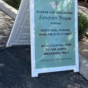 Follow the parking signs to the back, and if you need to park on the street, you should.