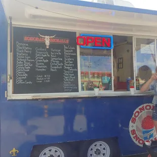 Gabby eating the tigersblood in front of the truck