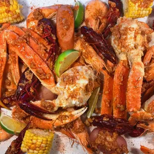 crab legs, corn, and corn on the cob