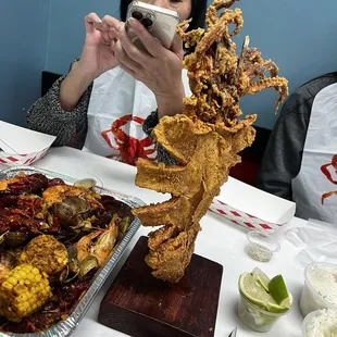 a woman taking a picture of her food