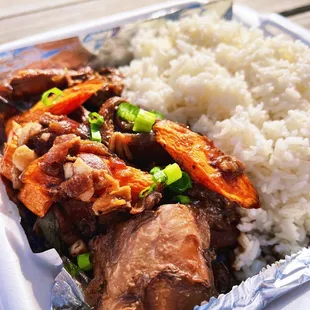 a plate of rice and meat