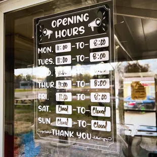 Opening Hours sign