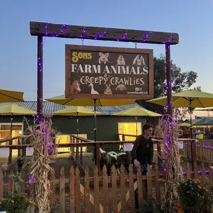 a man standing in front of a fence