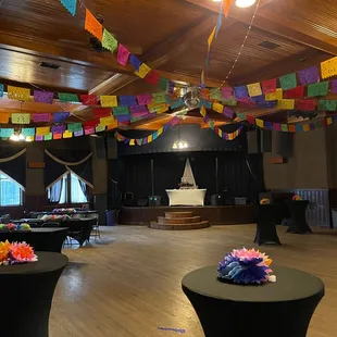 tables and chairs decorated with colorful flags