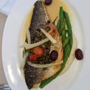 a plate of fish and vegetables