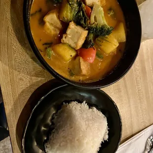 a bowl of rice and a bowl of tofu