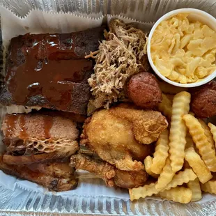SOOEY'S SAMPLER a combo of 1/4 rack of ribs, 2 pieces of fried chicken, pork BBQ, &amp; beef BBQ