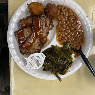 Brisket, hush puppies, baked beans, collard greens